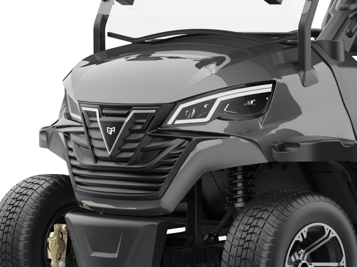 Close-up of the golf cart grille signature with the badge that carries the dealer's own mark